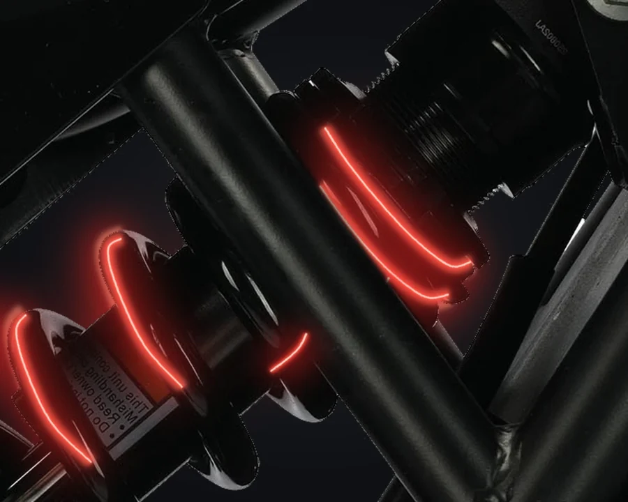 Ridge rear shock and mounting points with illustrative suspension-light effects.