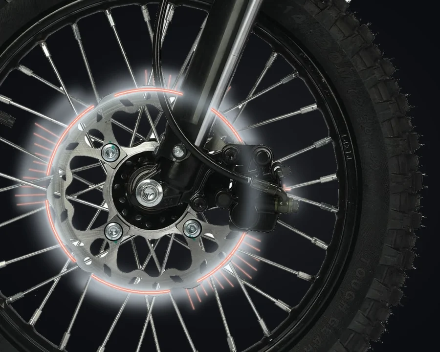 Ridge front brake disc, caliper and hydraulic line with illustrative light effects.